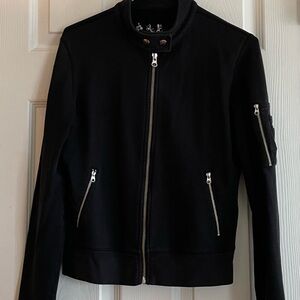 TNA- M size black sweat jacket. Many pockets